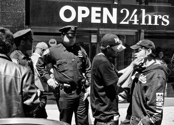 Lori George Photography - NYPD Officer overlooks person who was in some sort of confrontation|May 15,2015