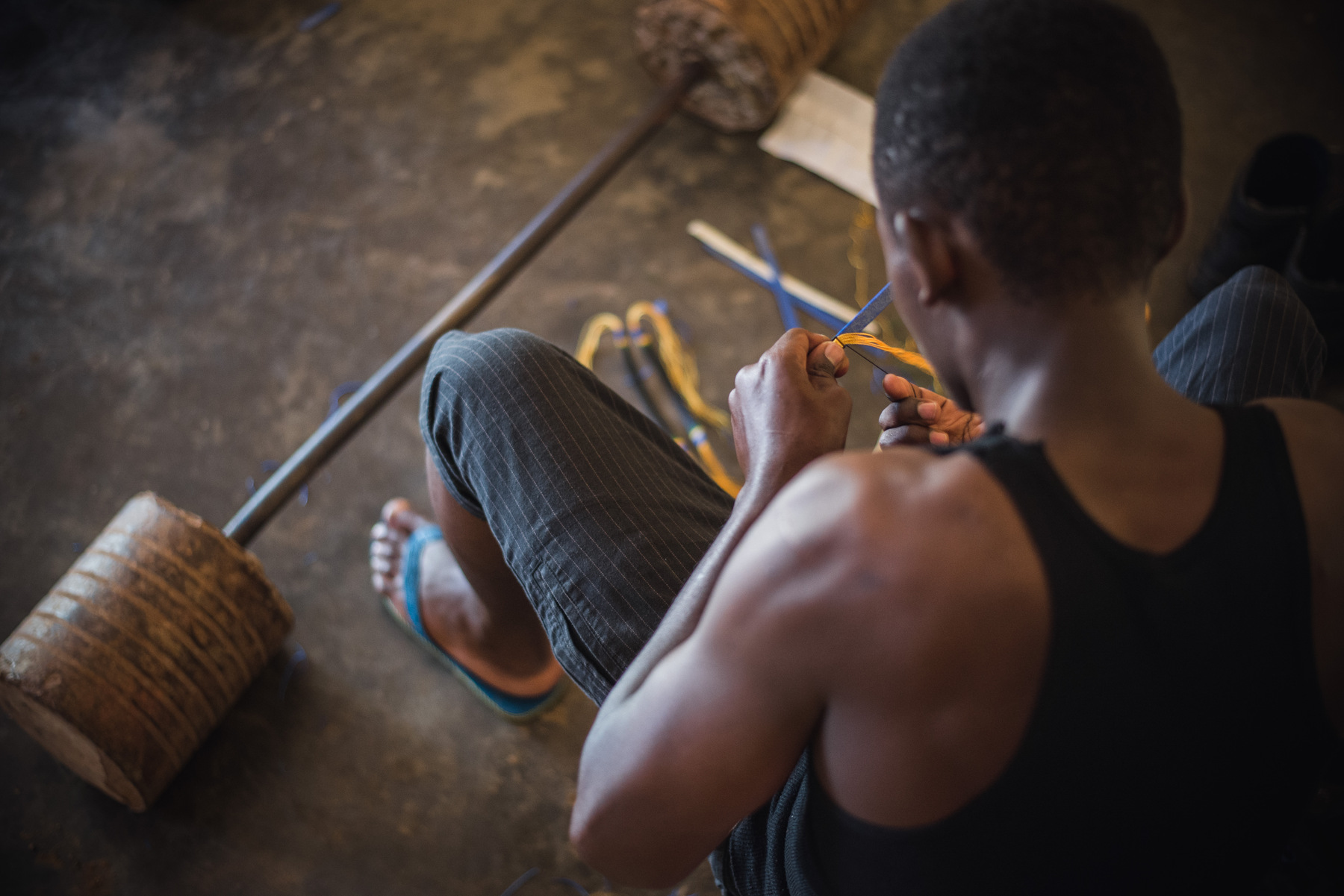 Julie Epp - Ferdinand making bracelets, Kigali, Rwanda
